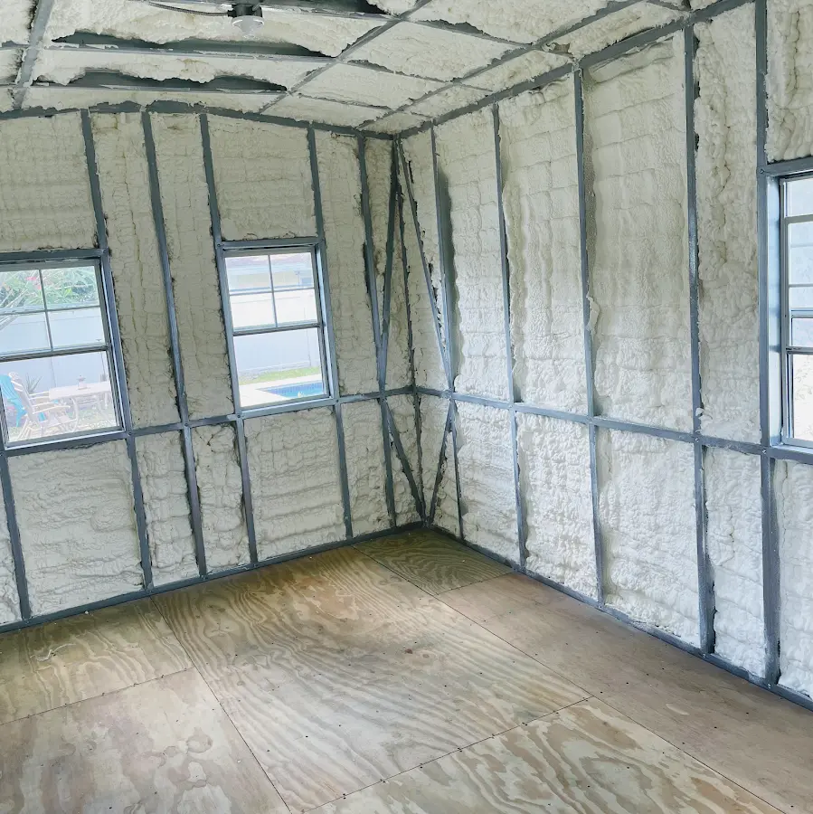 Closed-cell spray foam insulation applied to wall cavities in a residential project in Freeport